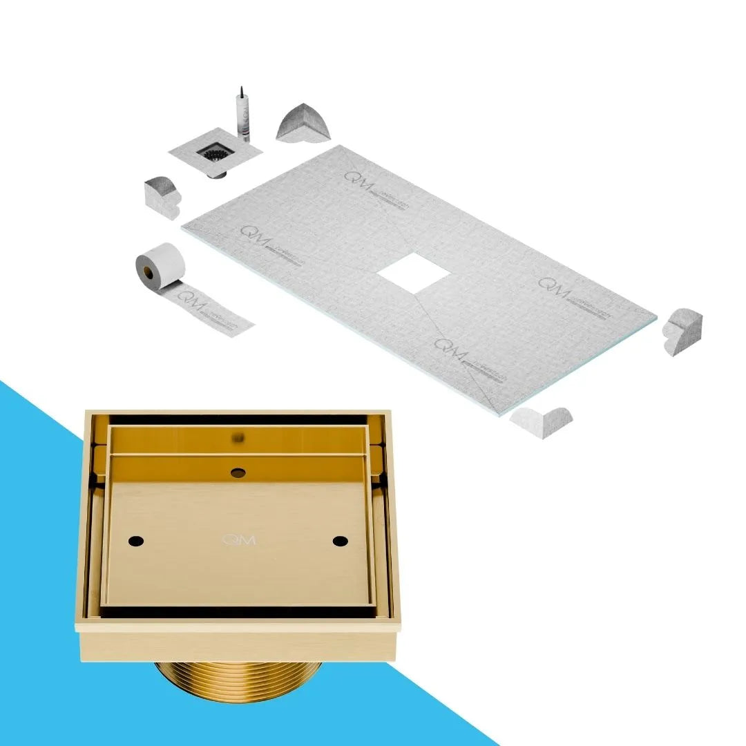 QM Drain Prefab Shower Curbless Mist Tile-In Center Square Drain 4x4 in Gold finish, featuring a stainless-steel channel with 'mist' perforated grate design. This drain allows seamless tile integration, offering efficient water drainage and a modern, minimalist aesthetic for luxury curbless shower installations.