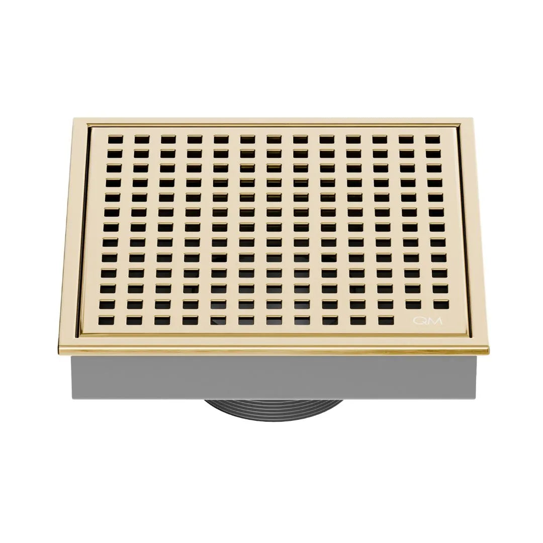 QM Drain Lagos Mira Square Drain 5 3/4 in Gold finish, featuring a sleek stainless-steel square design with a fine perforated grate. This drain offers efficient water drainage, seamless integration into modern shower floors, and a contemporary aesthetic for luxury bathroom installations.
