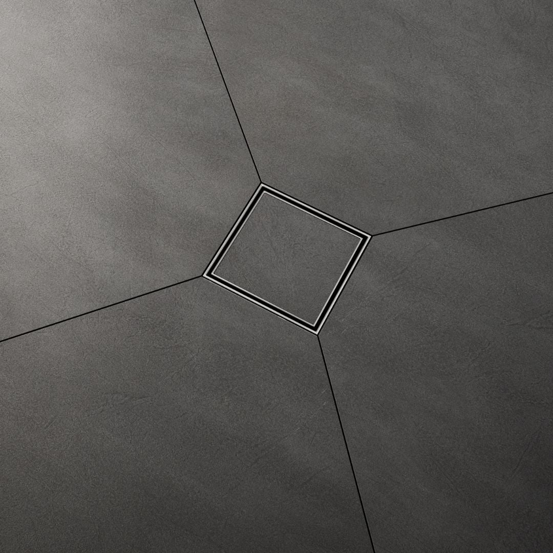 QM Drain Mist Tile-In Square Drain installed in a modern shower, featuring a sleek stainless-steel channel with fine perforated ‘mist’ grate. The drain seamlessly integrates with the tiled floor, offering efficient water drainage and a minimalist aesthetic, perfect for luxury bathroom installations.