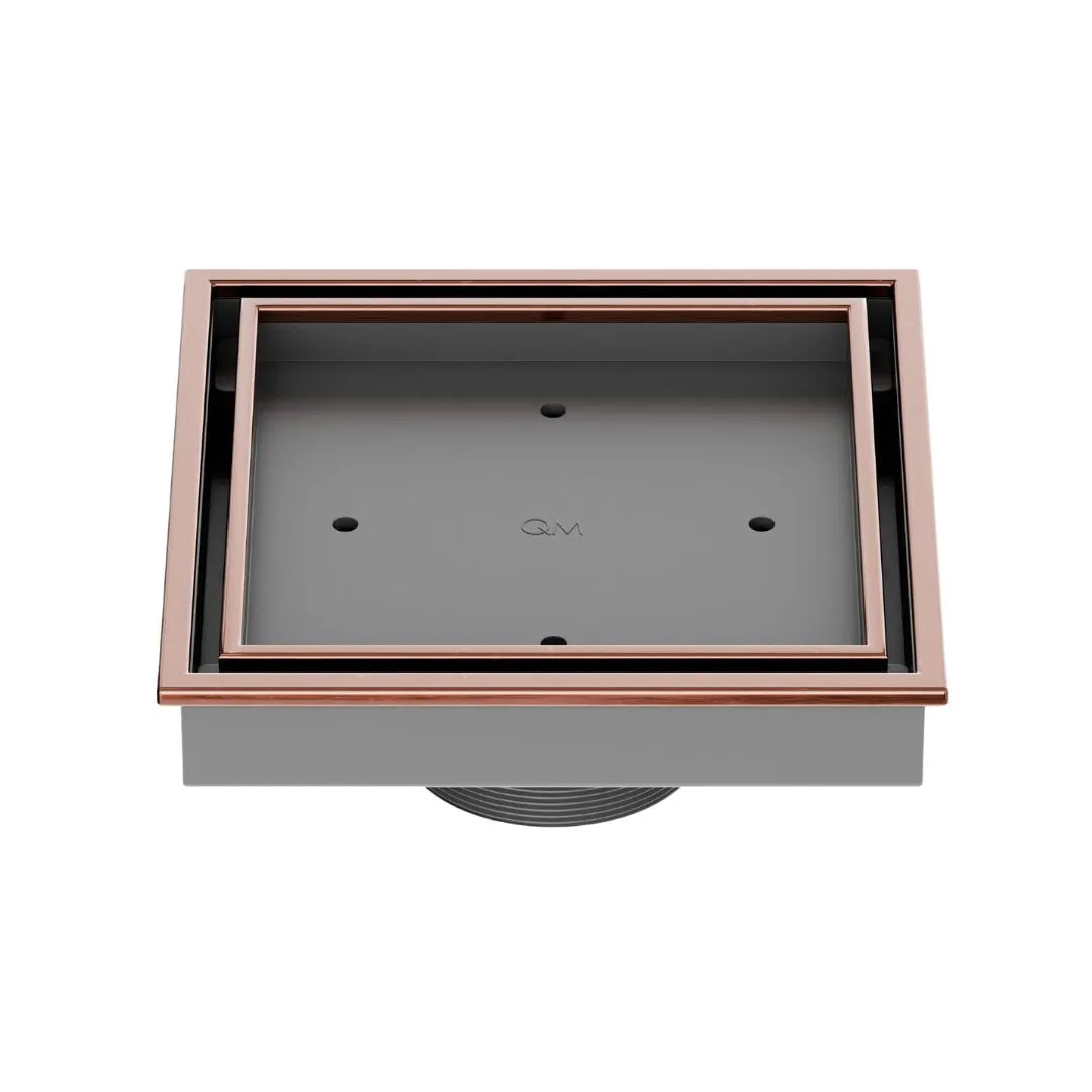 QM Drain Lagos Veil (Tile-In) Square Drain 5¾” in Bronze finish, featuring a sleek stainless-steel channel with a concealed grate design. This drain allows seamless tile integration, providing efficient water drainage while maintaining a modern, minimalist aesthetic for high-end shower and bathroom installations.