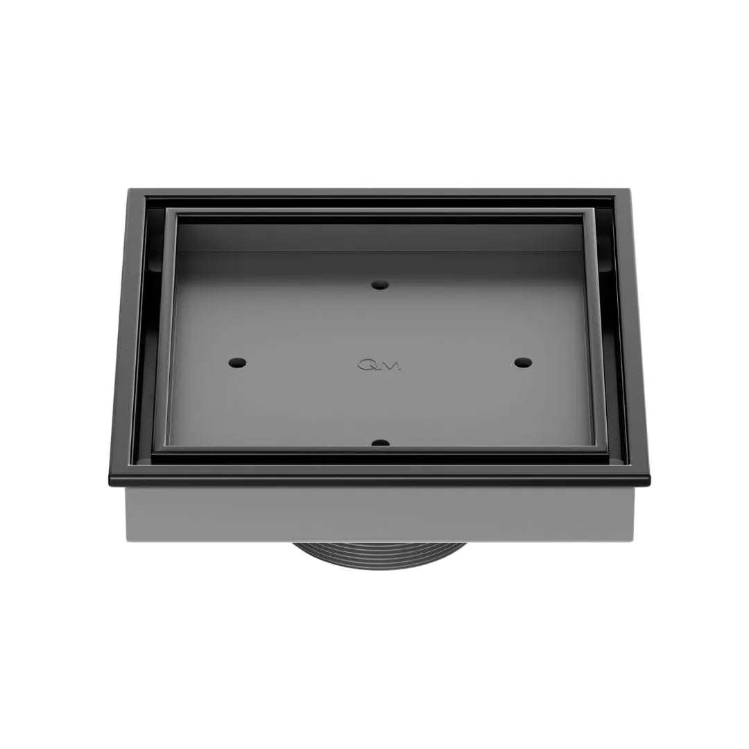 QM Drain Lagos Veil (Tile-In) Square Drain 5¾” in Black finish, featuring a sleek stainless-steel channel with a concealed grate design. This drain allows seamless tile integration, providing efficient water drainage while maintaining a modern, minimalist aesthetic for high-end shower and bathroom installations.