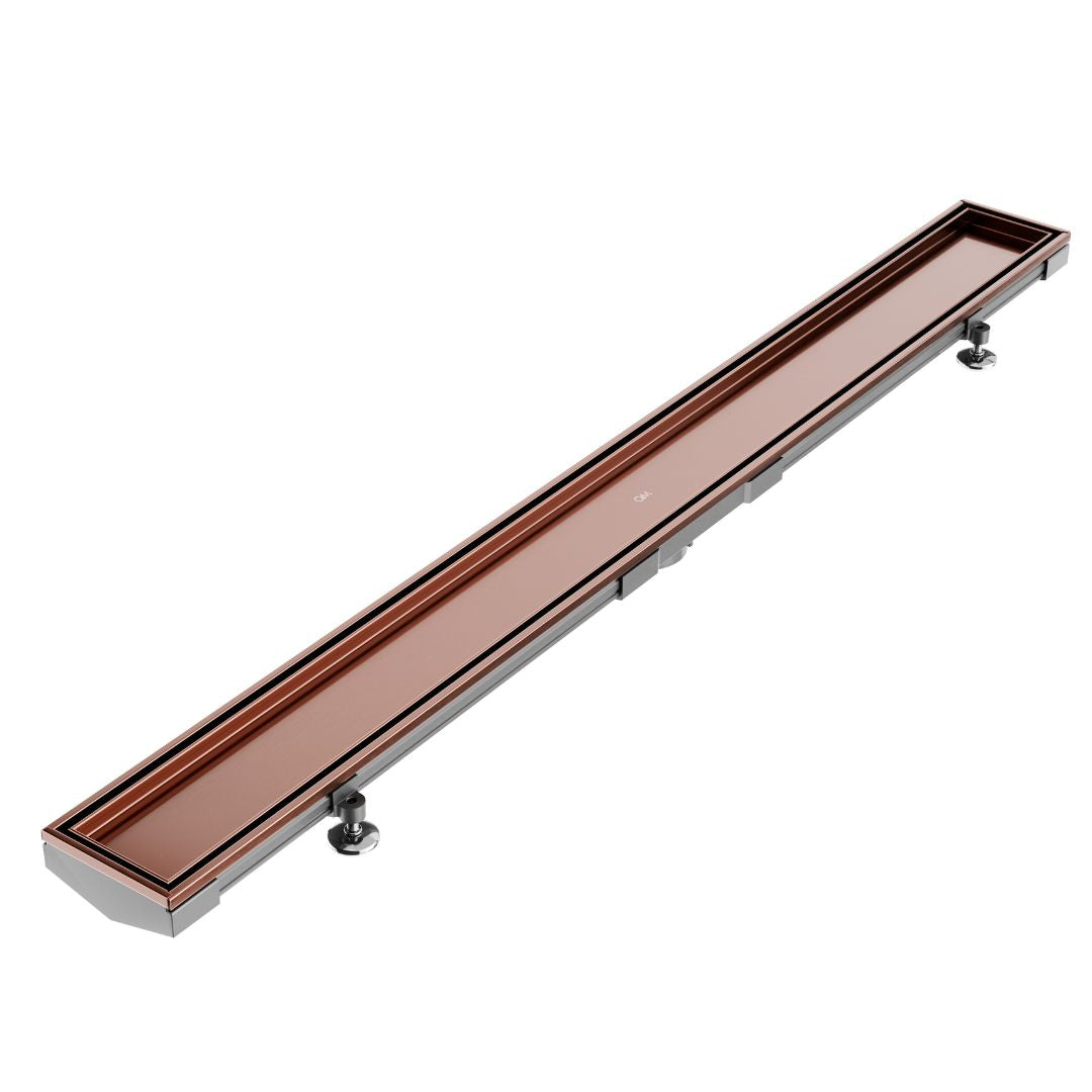 QM Drain Mist (Tile-In) Adjustable Lagos Linear Drain with 2-inch outlet in Bronze finish, featuring a stainless-steel channel with fine perforated 'mist' grate. This adjustable drain offers seamless tile integration, efficient water drainage, and a modern minimalist aesthetic for luxury shower installations.