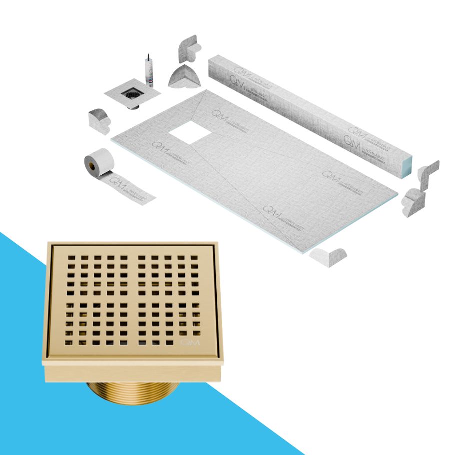 QM Drain Curb Kai Shower Pan Kit with Off Center Square Center Drain in Gold finish, featuring a sleek stainless-steel grate with fine square perforations. This kit ensures efficient water drainage, seamless tile integration, and a modern minimalist aesthetic for high-end shower and bathroom installations.