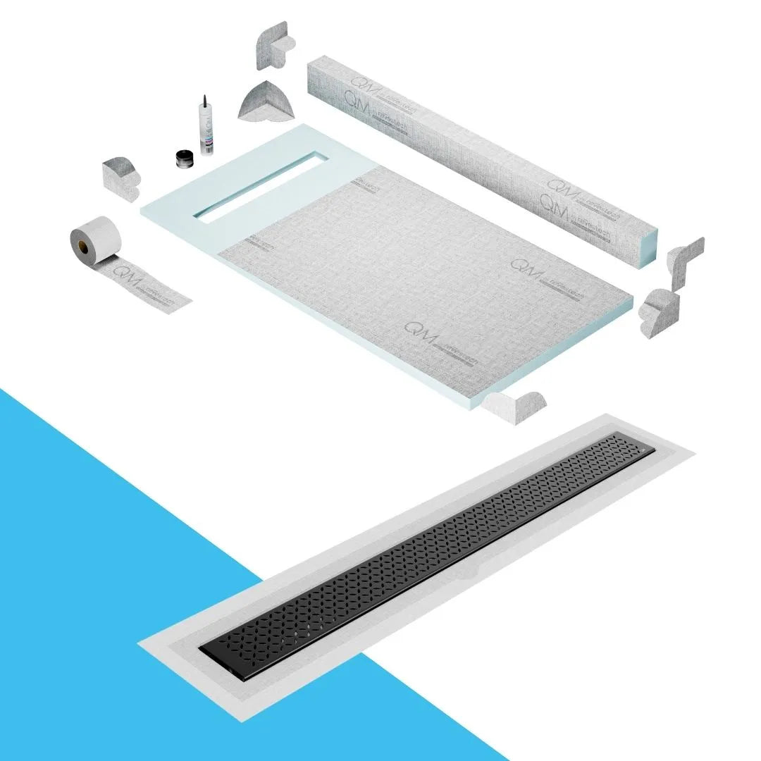QM Drain Curb Shower Pan with Delmar Lotus Flange Edge Linear Drain, stainless-steel decorative floral grate design, integrated flange for seamless tile installation, efficient drainage, offered in Satin, Gold, Bronze, Polished, and Black finishes.