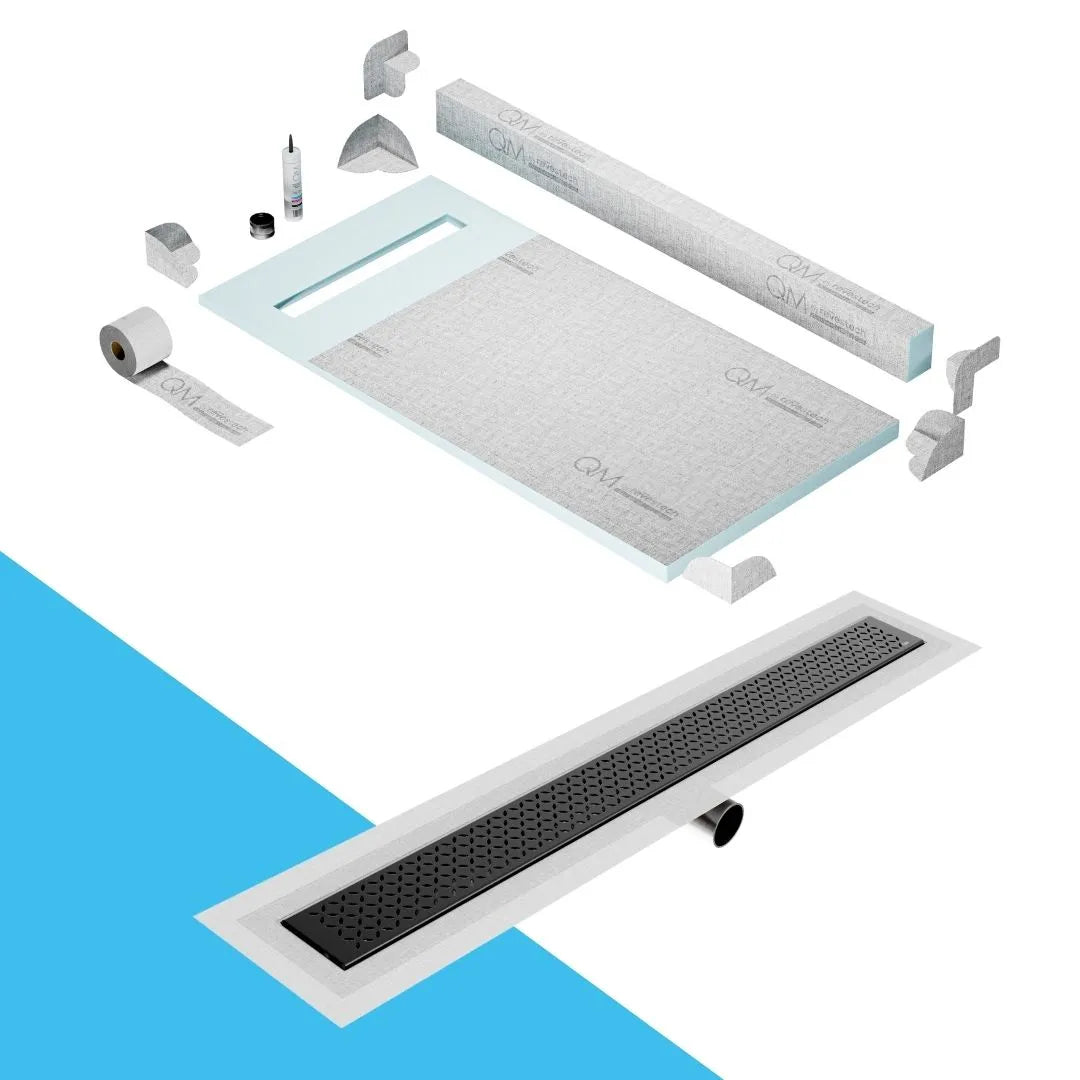 QM Drain Curb Shower Pan with Delmar Lotus Side Outlet Linear Drain, stainless-steel decorative floral-pattern grate, ensuring efficient drainage, available in Satin, Gold, Bronze, Polished, and Black finishes.