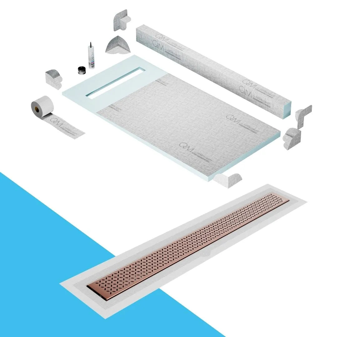 QM Drain Curb Shower Pan with Delmar Lotus Flange Edge Linear Drain, stainless-steel decorative floral grate design, integrated flange for seamless tile installation, efficient drainage, offered in Satin, Gold, Bronze, Polished, and Black finishes.