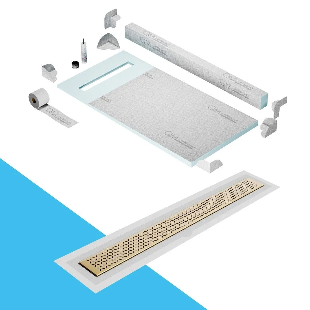 QM Drain Curb Shower Pan with Delmar Delta Flange Edge Linear Drain, stainless-steel grate featuring modern square perforations, efficient drainage with integrated flange, available in Gold, Bronze, Polished, and Black finishes.