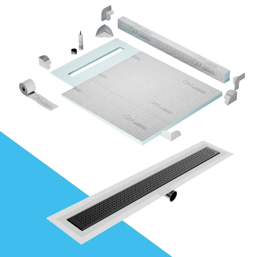 QM Drain Curb Shower Pan with Delmar Lotus Side Outlet Linear Drain, stainless-steel decorative floral-pattern grate, ensuring efficient drainage, available in Satin, Gold, Bronze, Polished, and Black finishes.