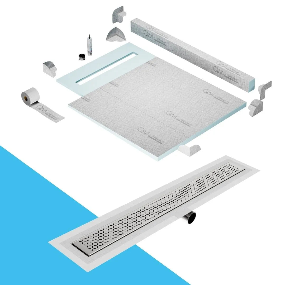 QM Drain Curb Shower Pan with Delmar Delta Side Outlet Linear Drain, featuring stainless-steel grate with modern square perforations, efficient drainage, available in Satin, Gold, Bronze, Polished, and Black finishes.