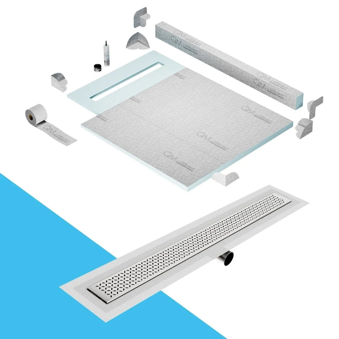 QM Drain Curb Shower Pan with Delmar Lotus Side Outlet Linear Drain, stainless-steel decorative floral-pattern grate, ensuring efficient drainage, available in Satin, Gold, Bronze, Polished, and Black finishes.