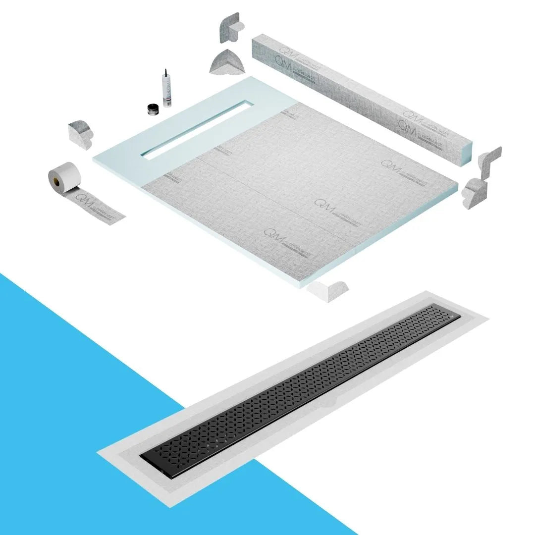 QM Drain Curb Shower Pan with Delmar Lotus Flange Edge Linear Drain, stainless-steel decorative floral grate design, integrated flange for seamless tile installation, efficient drainage, offered in Satin, Gold, Bronze, Polished, and Black finishes.