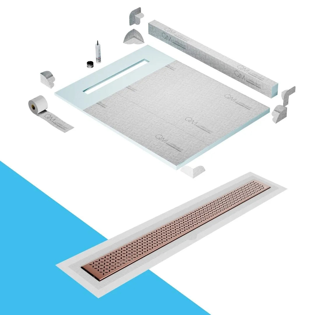 QM Drain Curb Shower Pan with Delmar Lotus Flange Edge Linear Drain, stainless-steel decorative floral grate design, integrated flange for seamless tile installation, efficient drainage, offered in Satin, Gold, Bronze, Polished, and Black finishes.