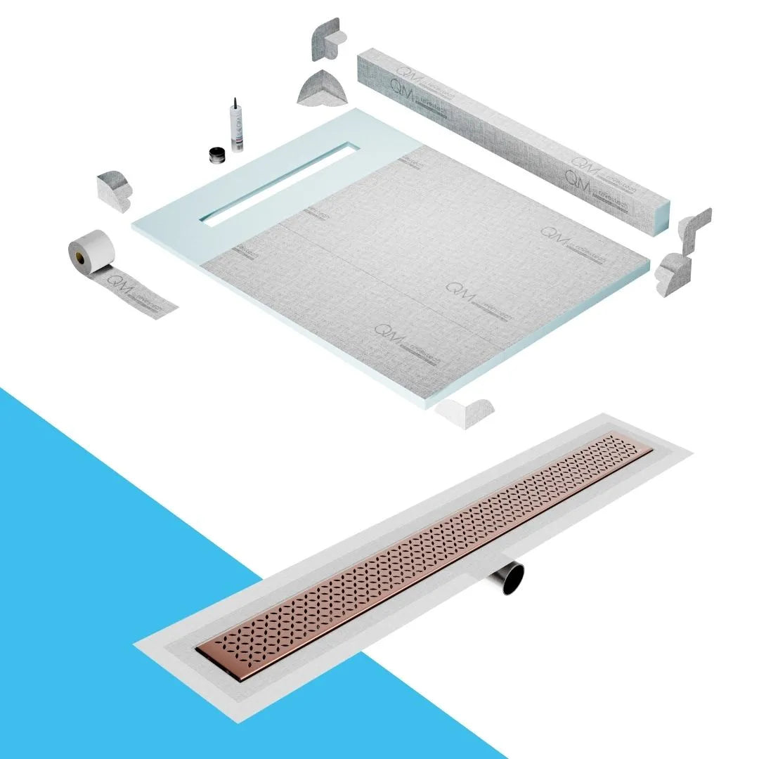 QM Drain Curb Shower Pan with Delmar Lotus Side Outlet Linear Drain, stainless-steel decorative floral-pattern grate, ensuring efficient drainage, available in Satin, Gold, Bronze, Polished, and Black finishes.