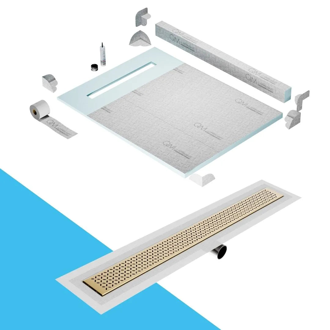 QM Drain Curb Shower Pan with Delmar Lotus Side Outlet Linear Drain, stainless-steel decorative floral-pattern grate, ensuring efficient drainage, available in Satin, Gold, Bronze, Polished, and Black finishes.
