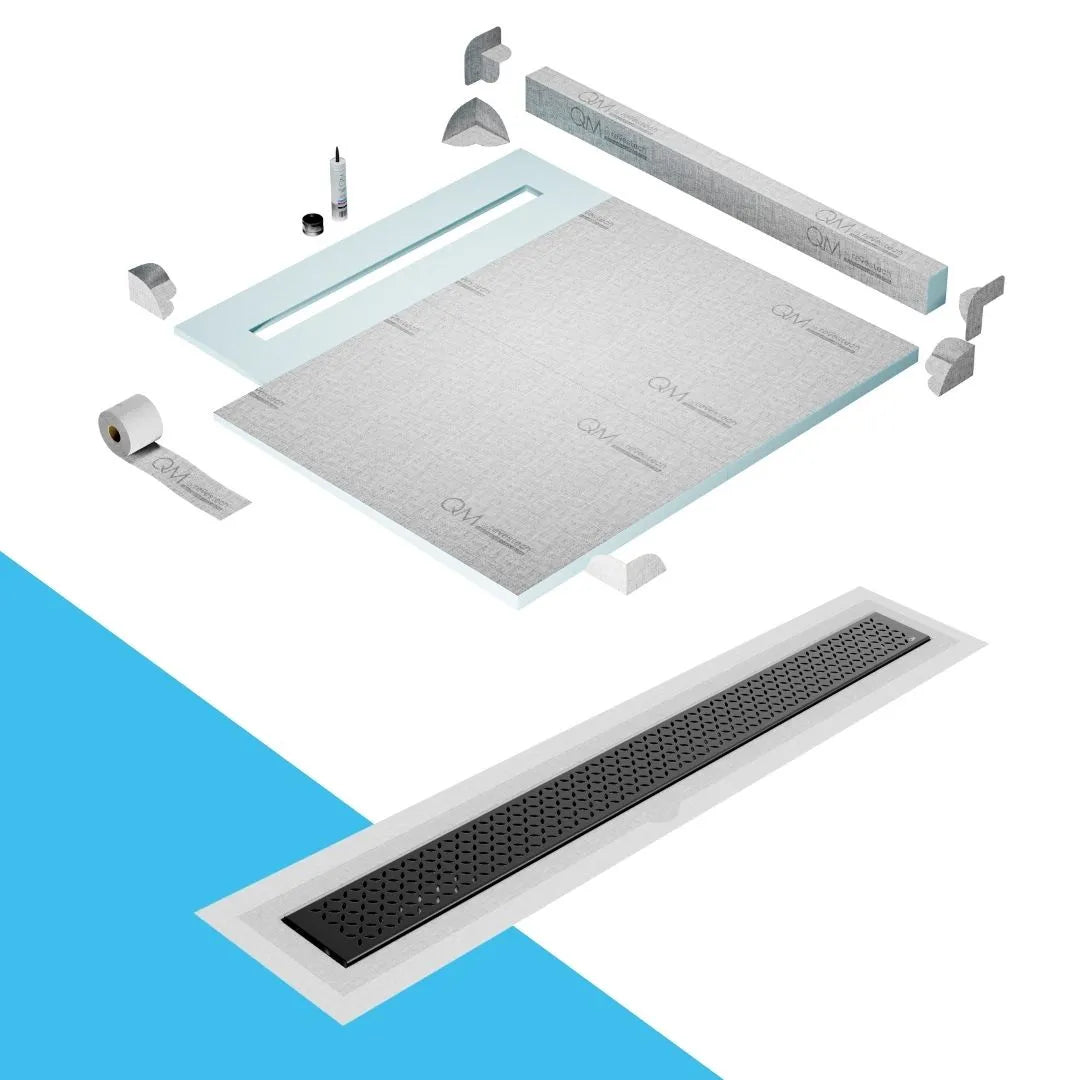 QM Drain Curb Shower Pan with Delmar Lotus Flange Edge Linear Drain, stainless-steel decorative floral grate design, integrated flange for seamless tile installation, efficient drainage, offered in Satin, Gold, Bronze, Polished, and Black finishes.