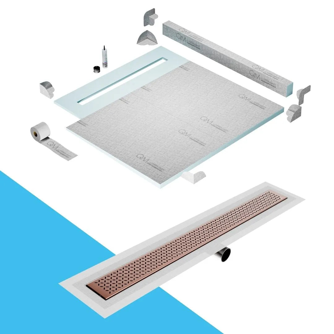 QM Drain Curb Shower Pan with Delmar Lotus Side Outlet Linear Drain, stainless-steel decorative floral-pattern grate, ensuring efficient drainage, available in Satin, Gold, Bronze, Polished, and Black finishes.