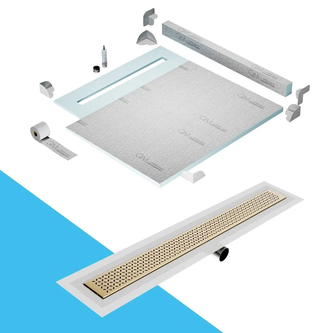 QM Drain Curb Shower Pan with Delmar Lotus Side Outlet Linear Drain, stainless-steel decorative floral-pattern grate, ensuring efficient drainage, available in Satin, Gold, Bronze, Polished, and Black finishes.