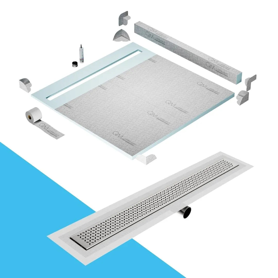 QM Drain Curb Shower Pan with Delmar Lotus Side Outlet Linear Drain, stainless-steel decorative floral-pattern grate, ensuring efficient drainage, available in Satin, Gold, Bronze, Polished, and Black finishes.