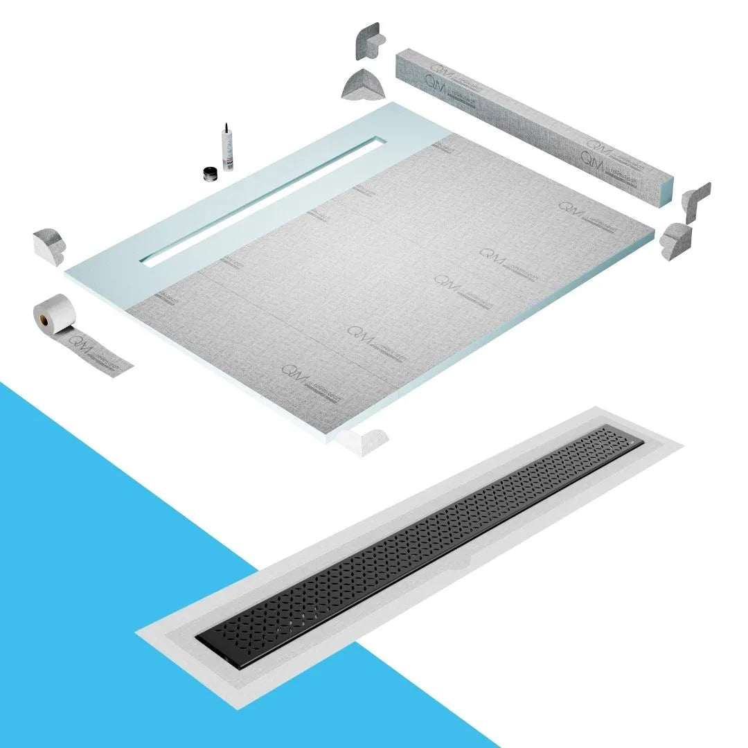 QM Drain Curb Shower Pan with Delmar Lotus Flange Edge Linear Drain, stainless-steel decorative floral grate design, integrated flange for seamless tile installation, efficient drainage, offered in Satin, Gold, Bronze, Polished, and Black finishes.