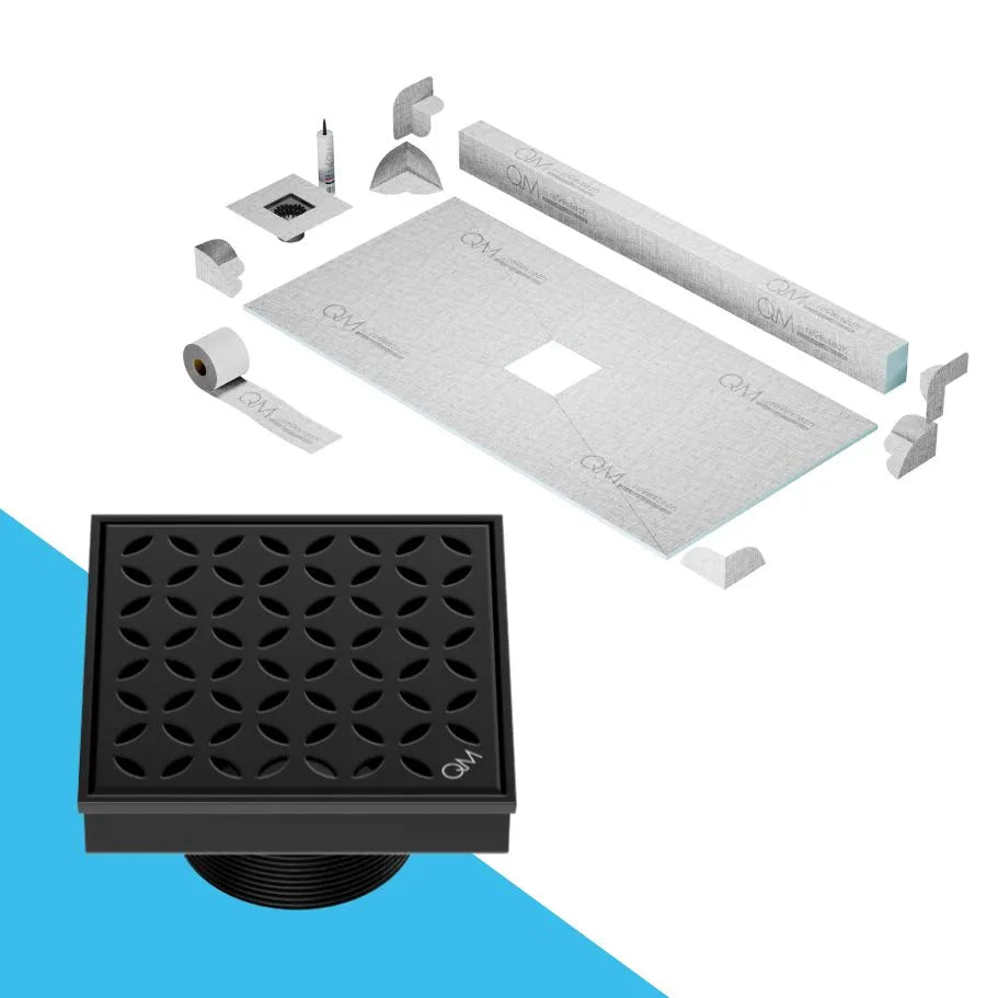 QM Drain Curb Shower Pan with Delmar Lotus Center Square Drain, stainless-steel floral-pattern grate, available in Satin, Gold, Bronze, Polished, and Black finishes, offering elegant aesthetics and effective water drainage for luxury bathrooms.