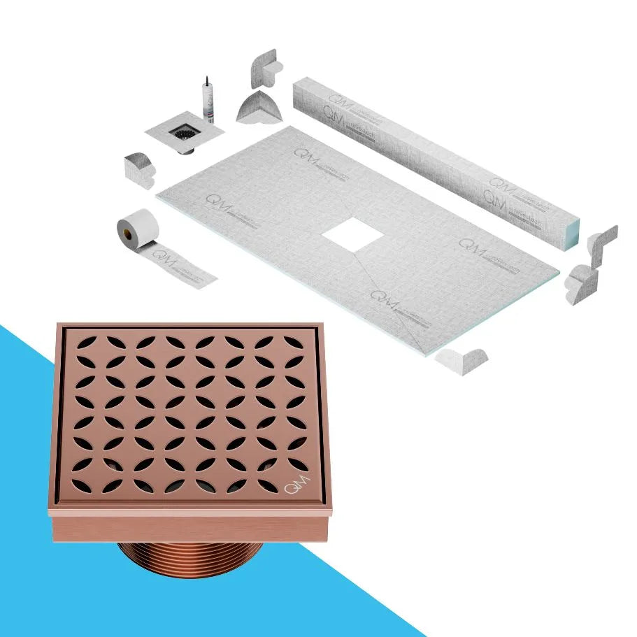 QM Drain Curb Shower Pan with Delmar Lotus Center Square Drain, stainless-steel floral-pattern grate, available in Satin, Gold, Bronze, Polished, and Black finishes, offering elegant aesthetics and effective water drainage for luxury bathrooms.