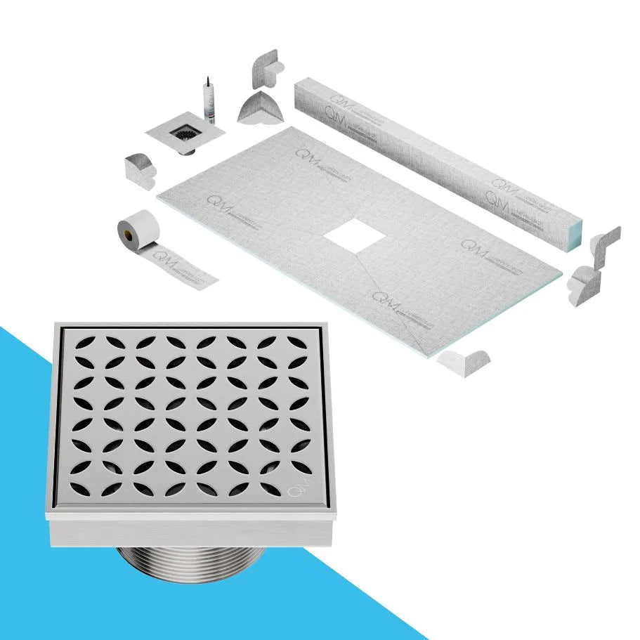 QM Drain Curb Shower Pan with Delmar Lotus Center Square Drain, stainless-steel floral-pattern grate, available in Satin, Gold, Bronze, Polished, and Black finishes, offering elegant aesthetics and effective water drainage for luxury bathrooms.