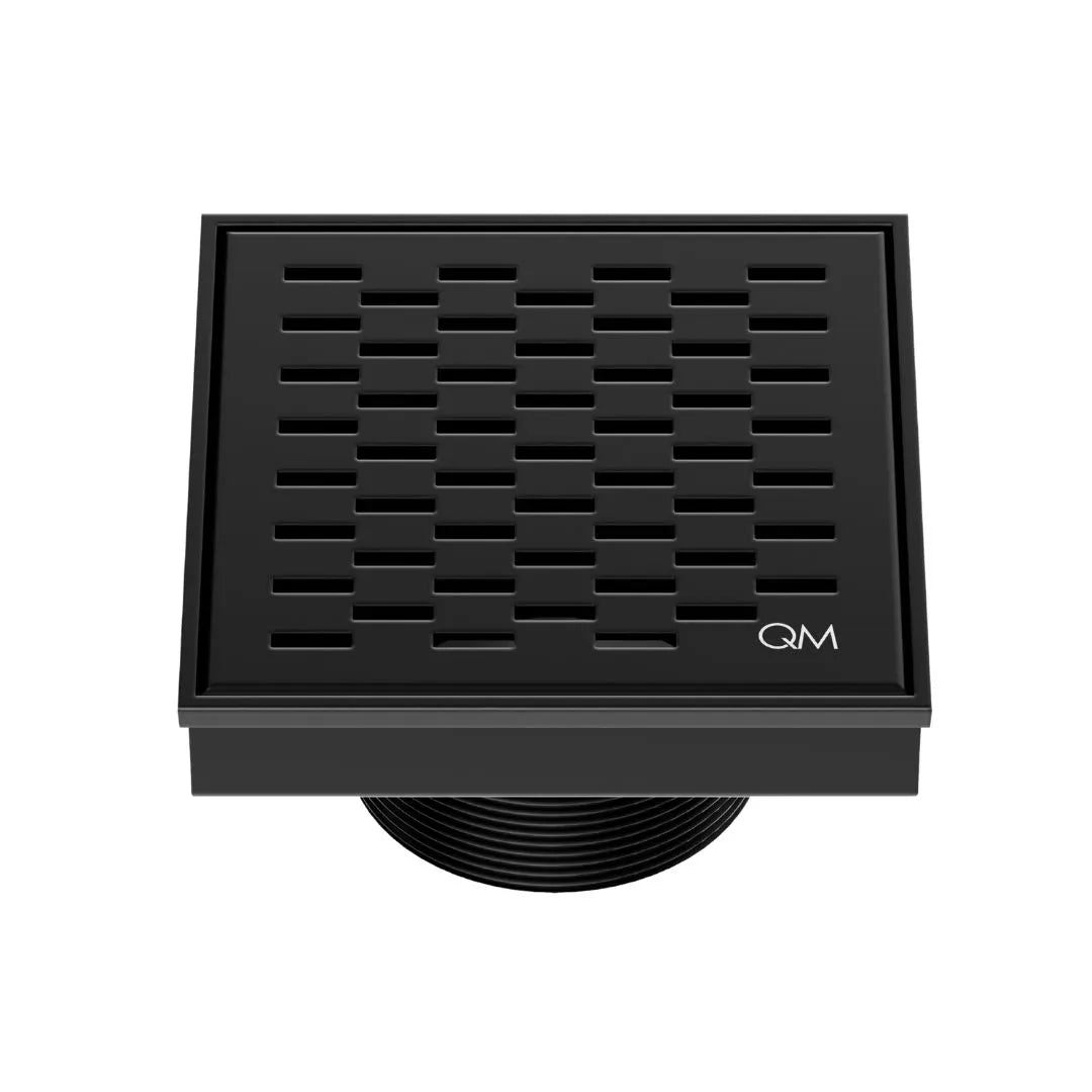QM Drain Delmar Delta Square Drain 4x4-inch in Black finish, featuring a sleek stainless-steel square-pattern grate. This drain offers efficient water drainage, seamless tile integration, and a modern, minimalist design, perfect for high-end shower and bathroom floor installations.