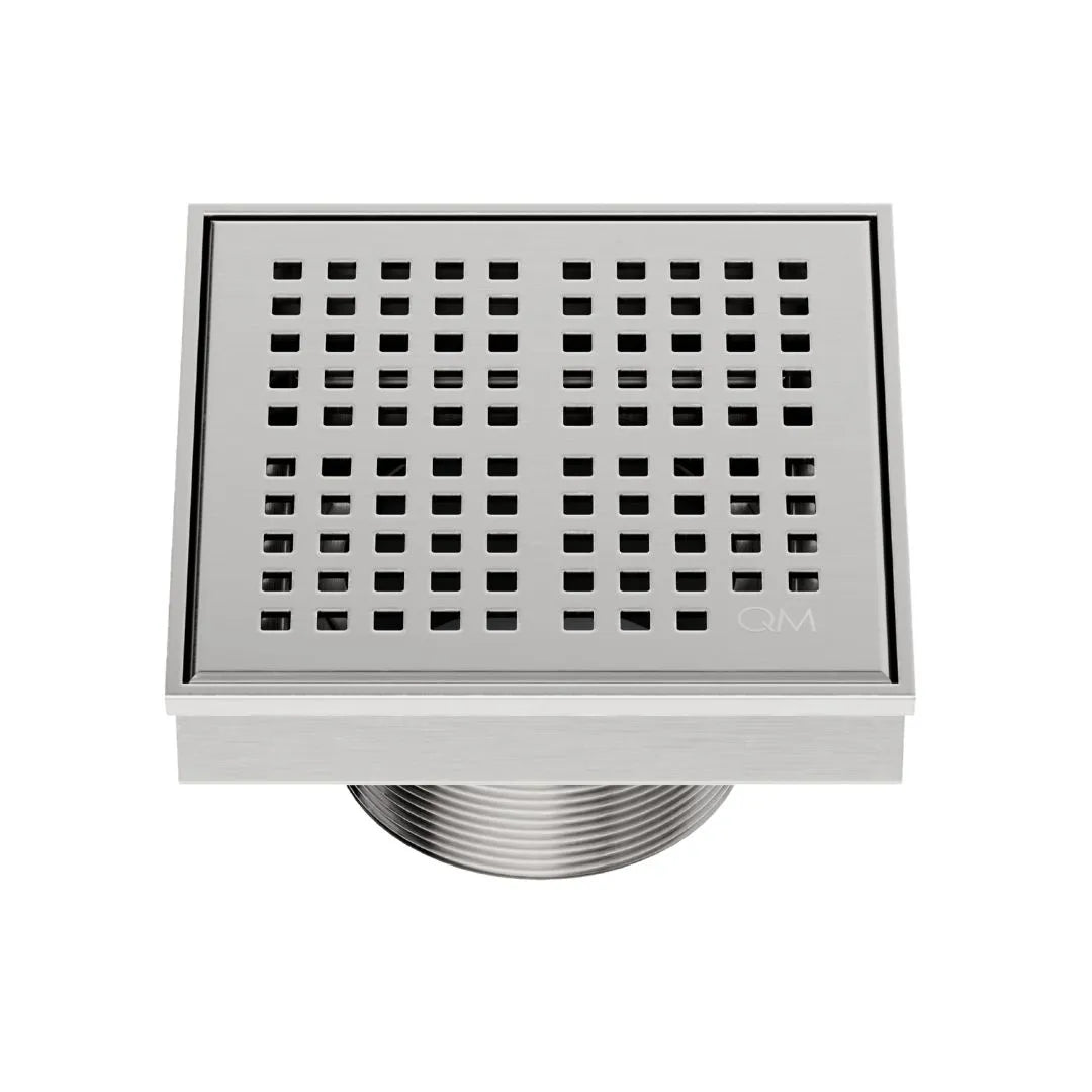 QM Drain Delmar Kai Square Drain 4x4-inch in Satin finish, featuring a sleek stainless-steel grate with fine square perforations. This drain provides efficient water drainage, seamless tile integration, and a high-end polished aesthetic, ideal for luxury shower and bathroom floor installations.