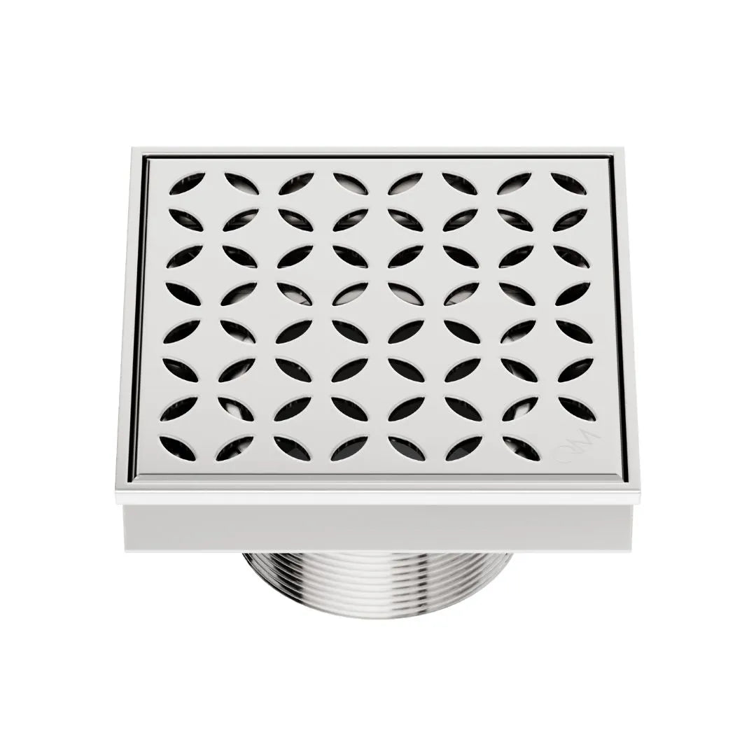QM Drain Delmar Lotus Square Drain 4x4-inch in Polished finish, featuring a sleek stainless-steel channel with an elegant floral-pattern grate. This drain provides efficient water drainage, seamless tile integration, and a modern minimalist aesthetic, perfect for luxury shower and bathroom floor installations.