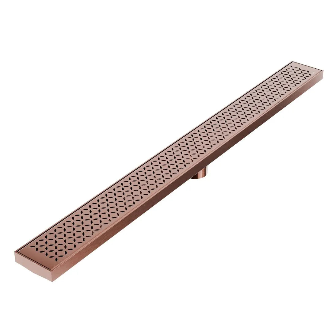 QM Drain Lotus Delmar Standard Length Plain Edge Linear Drain in Bronze finish, featuring a sleek stainless-steel channel with a smooth plain edge design. This drain ensures seamless tile integration and efficient water drainage, adding an elegant, modern touch to luxury bathroom installations.