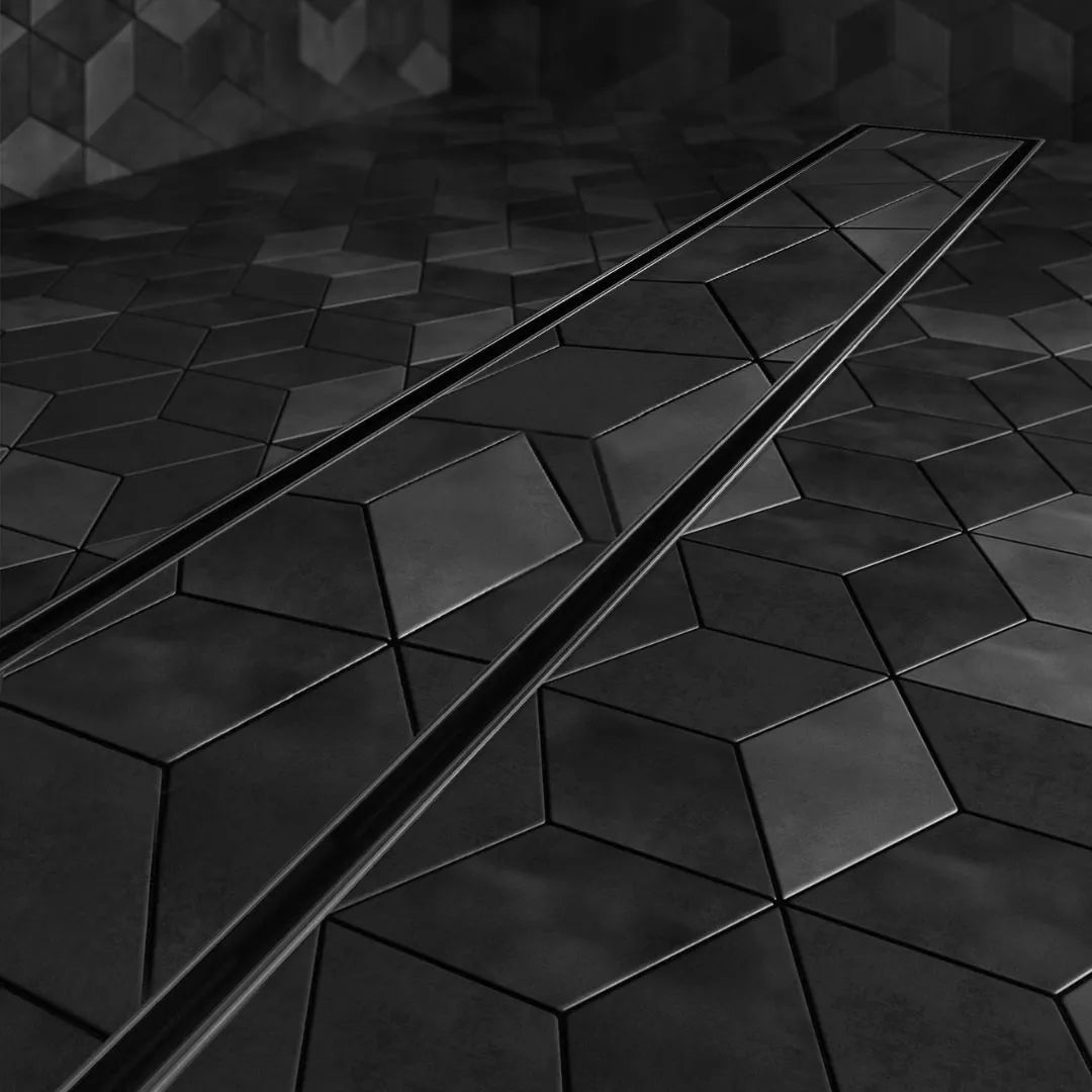 QM Drain Mist Tile-In Delmar Standard Length Plain Edge Linear Drain, showcasing the sleek stainless-steel channel with a smooth plain edge and fine ‘mist’ perforated grate. This image highlights the efficient water drainage and seamless integration into modern shower floors, enhancing luxury bathroom designs.