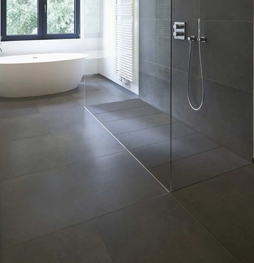 QM Drain Invisible Shower Tray 1 featured in a sleek, contemporary bathroom with seamless integration into the floor. The tray provides efficient water drainage and a modern minimalist design, perfect for enhancing the luxury aesthetic and functionality of high-end shower and bathroom floor installations.