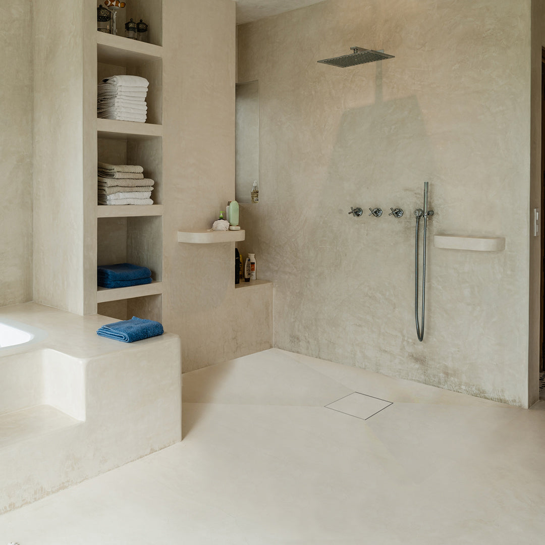 Modern shower floor showcasing the QM Drain Invisible Square Tile-In Drain—4″×4″ stainless-steel concealed grate flush with surrounding tiles, featuring integrated waterproofing flange and efficient high-flow drainage for a seamless minimalist aesthetic.