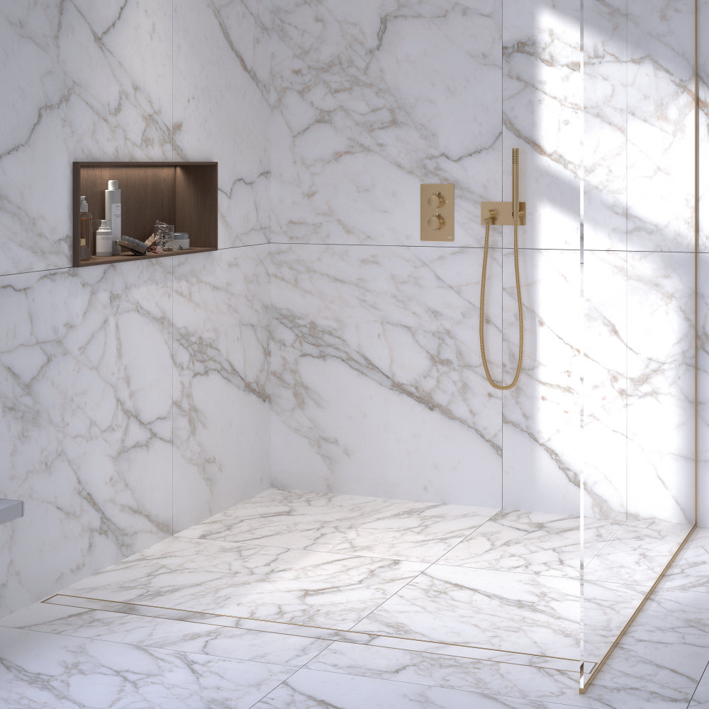 QM Drain product image showcasing the Mist (Tile-In) Gold Linear Drain. Featuring a luxurious gold finish, this drain integrates seamlessly with tiles, ensuring efficient water drainage while adding a touch of elegance to modern shower installations and luxury bathroom designs.