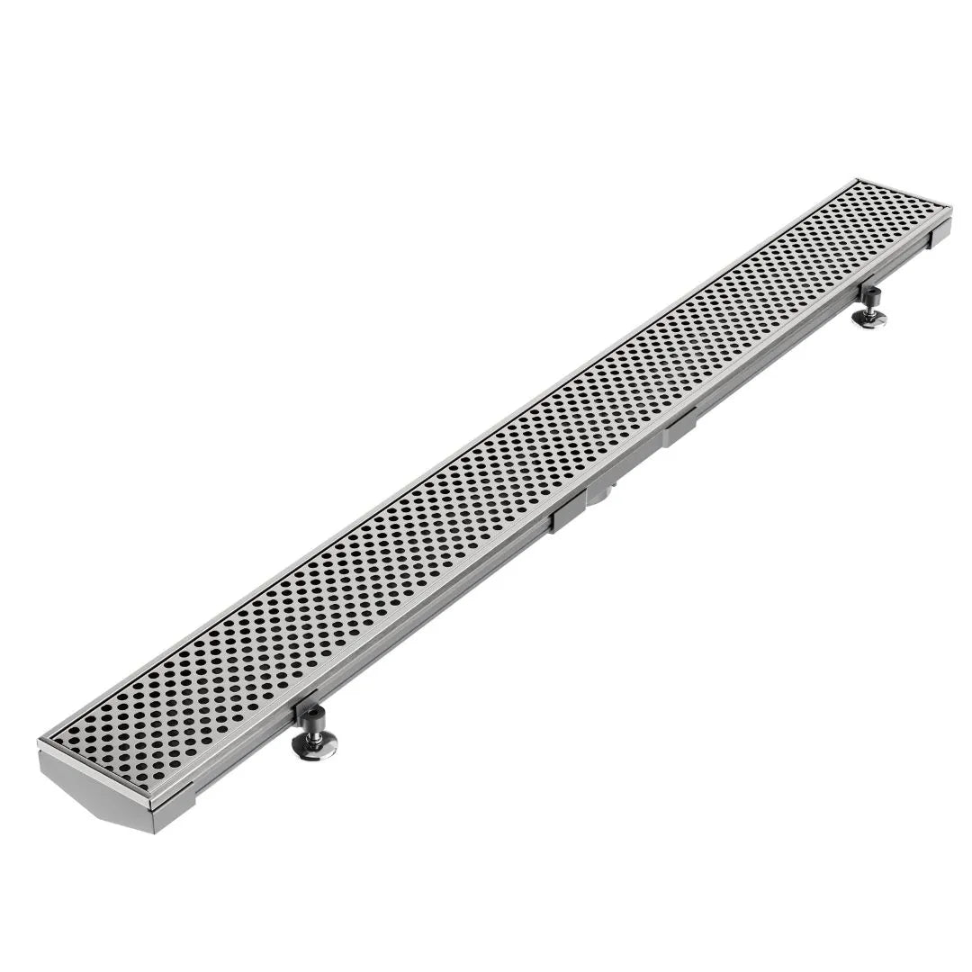 Modern shower floor showcasing the Perforated Adjustable Kit Lagos Linear Drain in Polished finish with 3ā³ outletāstainless-steel adjustable-length channel featuring precision perforated grate, integrated waterproof flange beneath surrounding tiles, and versatile on-site frame for efficient customizable drainage.