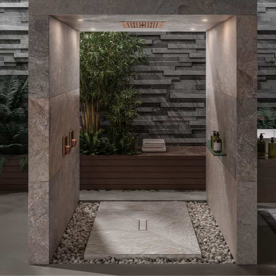 Modern shower floor showcasing the QM Drain Veil Linear Drain Lagos 2″ outlet—sleek stainless-steel channel with concealed veil-pattern grate, integrated waterproof flange beneath surrounding tiles, and high-capacity drainage for seamless, customizable luxury bathroom installations.