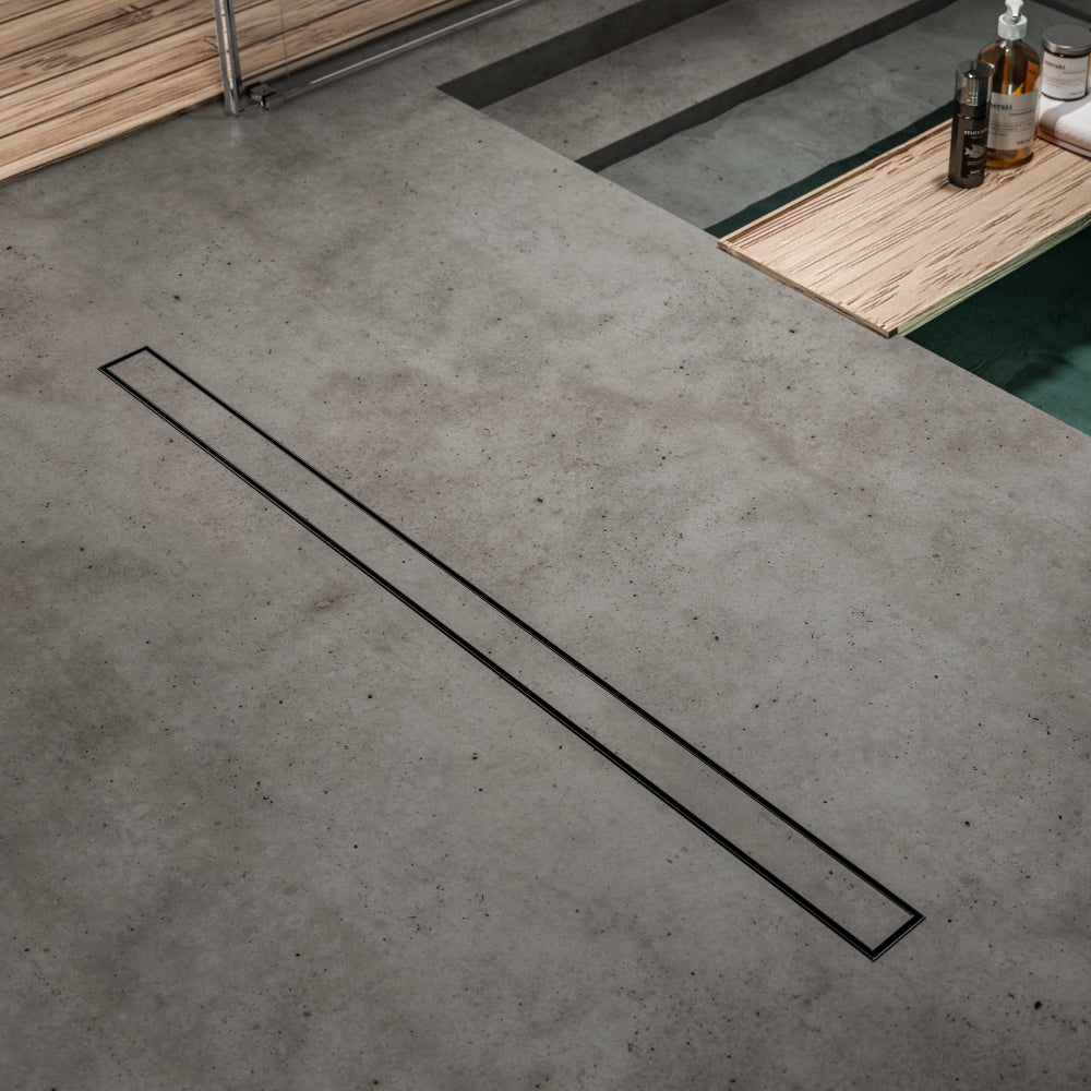 QM Drain product image showcasing the Mist (Tile-In) Black Linear Drain, designed for modern bathrooms. The drain offers seamless tile integration, efficient water flow, and a sleek black finish, ideal for minimalist, high-end shower installations looking for both functionality and style.