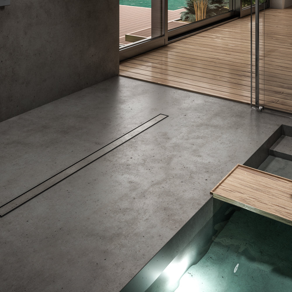 QM Drain ambientación featuring the Mist (Tile-In) Black Linear Drain, showcasing its sleek, minimalist design in a modern shower setup. The image emphasizes the drain's seamless integration with black tiles, ensuring efficient water flow and a clean, contemporary aesthetic for luxury bathroom installations.