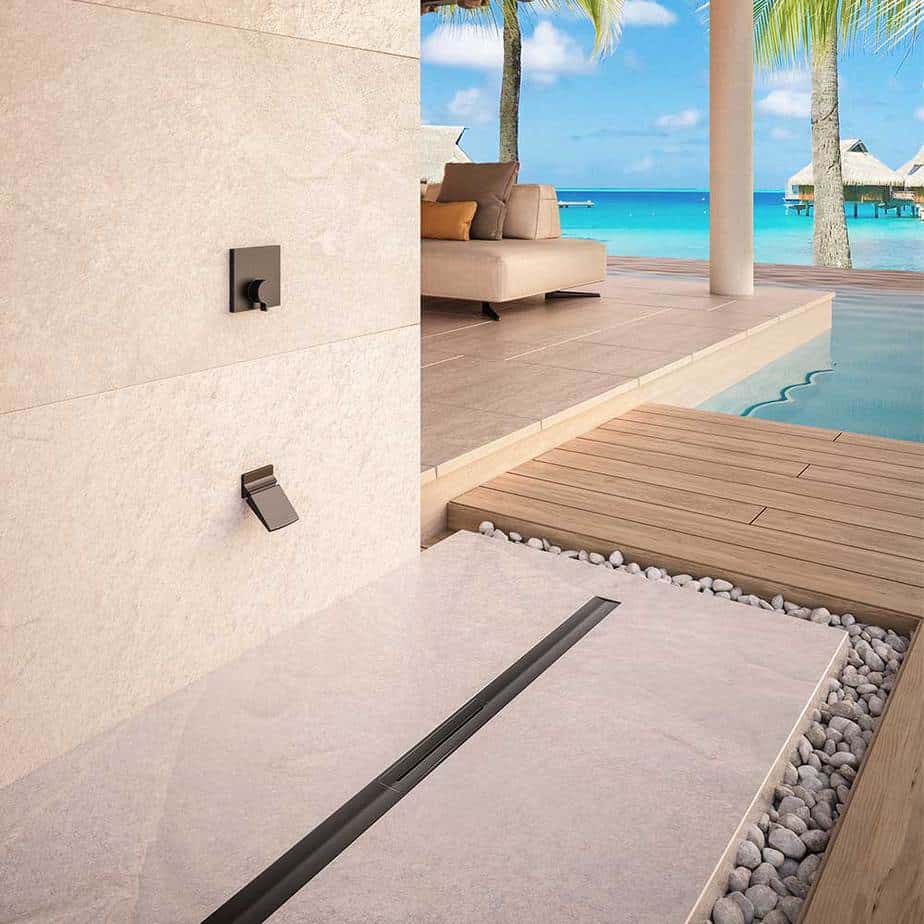 Modern bathroom showcasing the QM Drain Supreme Linear Drain in Polished finish—sleek stainless-steel channel installed at the shower threshold, featuring a minimalist removable grate, integrated waterproof flange, and high-flow drainage for contemporary luxury bath designs.