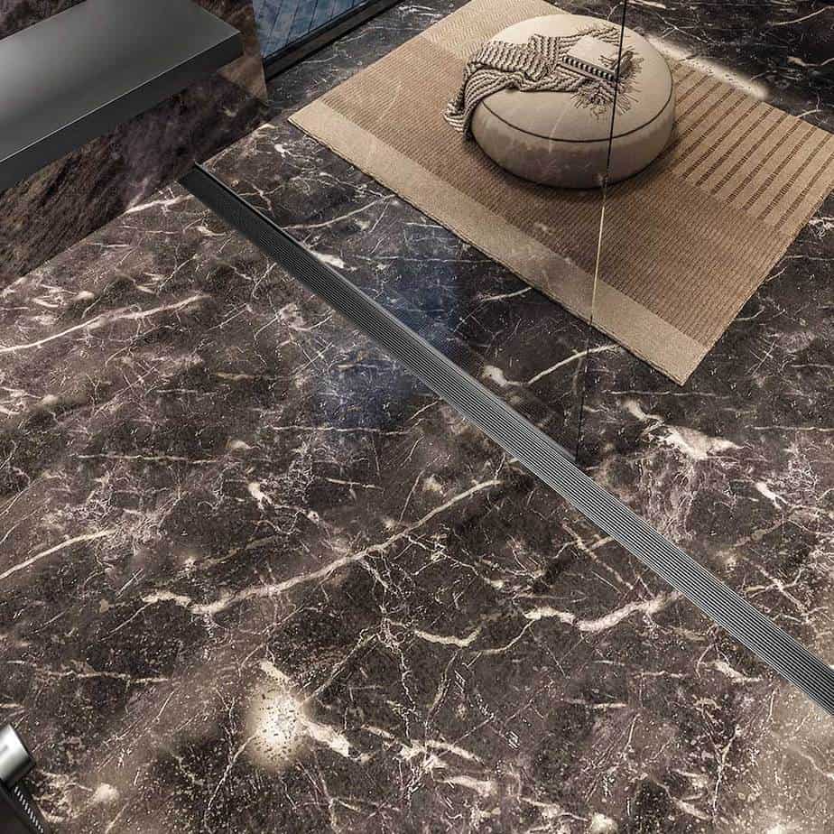 Modern bathroom showcasing QM Drain Wedgewire Linear Drain in Satin finish—sleek stainless-steel channel flush with tile, featuring corrosion-resistant wedge-wire grate and efficient high-flow drainage for seamless luxury shower installations.