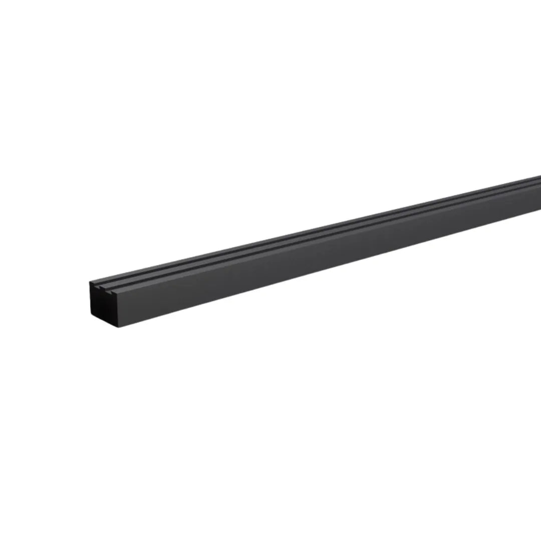 Modern bathroom wall detail featuring QM Drain Wall Trim – sleek stainless-steel profile installed at shower floor-to-wall junction, providing a clean transition, waterproof seal, and protection against moisture intrusion in luxury wet-room installations.