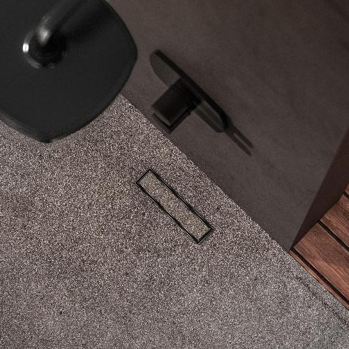 QM Drain Lagos Veil (Tile-In) Linear Drain Banner, showcasing a sleek stainless-steel linear drain with a concealed grate design for seamless tile integration. The banner highlights efficient water drainage, minimalist aesthetics, and modern style, ideal for luxury shower and bathroom floor installations.