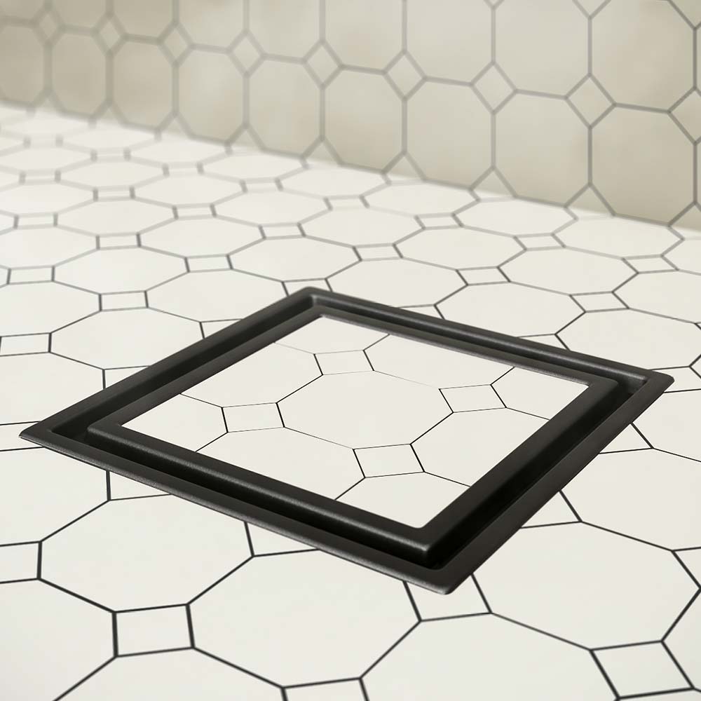 QM Drain Lagos Veil Tile-In Square Drain, showcasing the stainless-steel channel with a concealed grate design. This drain provides seamless tile integration, efficient water drainage, and a minimalist modern look, ideal for high-end bathroom and shower installations.