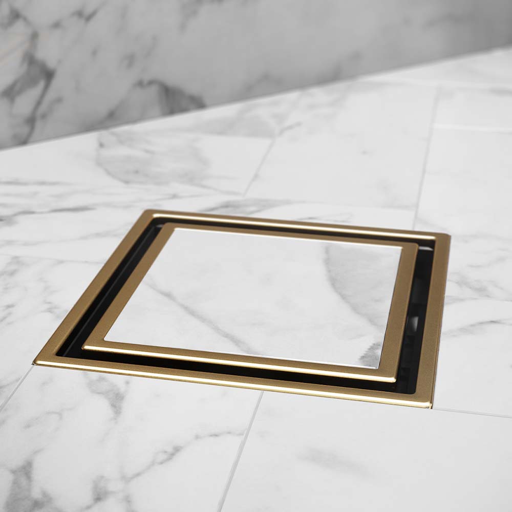 QM Drain Lagos Veil Tile-In Square Drain, showcasing its sleek stainless-steel channel with a concealed grate design. The drain provides efficient water drainage, seamless tile integration, and a minimalist aesthetic, ideal for modern luxury bathroom and shower installations.