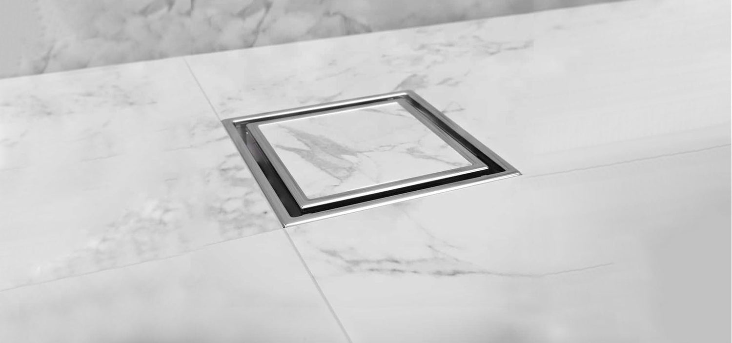 Banner showing Veil Center Drains in 4x4 and 5 ¾ sizes installed on a bathroom floor, highlighting premium stainless steel construction, modern style, and durable performance by QM Drain.