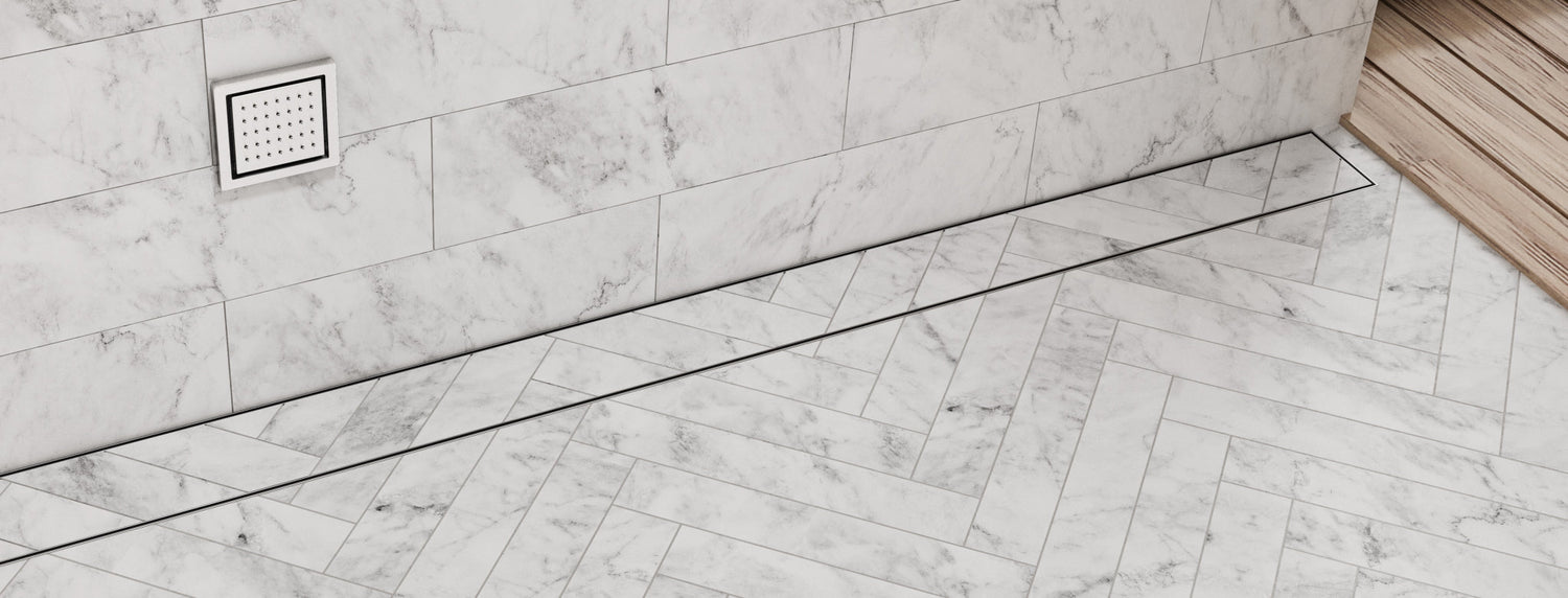 Banner showing QM Drain’s collection of linear shower drains from Bay, Delmar, Lagos, and Invisible Drain series, highlighting sleek stainless steel design, modern style, and durable performance.