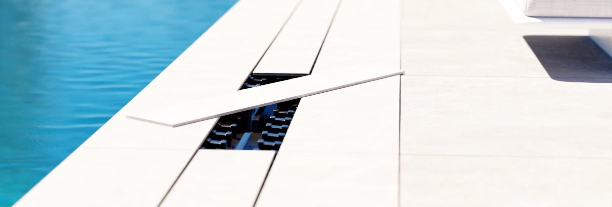 Banner showing an outdoor stainless steel channel drain from QM Drain, highlighting marine-grade construction, weather-resistant design, and efficient water management for exterior spaces.