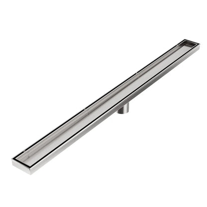 QM Drain Bay 2-in-1 Linear Drain with Reversible Grate, featuring a sleek stainless-steel channel and a versatile reversible grate design. This drain offers efficient water drainage, seamless tile integration, and the flexibility to adapt to different aesthetic preferences in luxury bathroom installations.