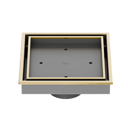 QM Drain Lagos Veil (Tile-In) Square Drain 5¾” in Gold finish, featuring a sleek stainless-steel channel with a concealed grate design. This drain allows seamless tile integration, providing efficient water drainage while maintaining a modern, minimalist aesthetic for high-end shower and bathroom installations.
