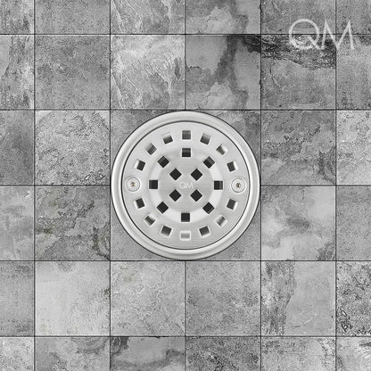 Rounded stainless-steel tile-in drain positioned at center, featuring sleek grate design, integrated waterproofing flange, and efficient high-flow drainage for upscale bathroom aesthetics.